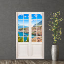 Hingucker für dunkle Räume oder ohne Fenster, selbstklebendes Wandtattoo als Terrassentür mit dem Blick Dorf am See im Sommer. Hier an einer dunklen Wand verklebt neben einer Bodenvase.