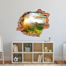 Wandtattoo - Wanddurchbruch Aufkleber "Waldlichtung" im Kinderzimmer an einer hellblauen Wand über einem Sideboard verklebt.