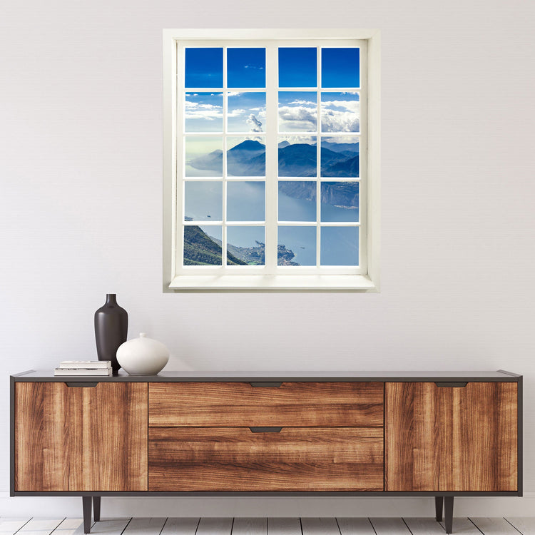 Wandaufkleber Sprossenfenster geschlossen, mit toller Aussicht in die Ferne "Berge und See"- vergrößert Zimmer optisch. Hier über einer Holzkommode an der Wand verklebt.