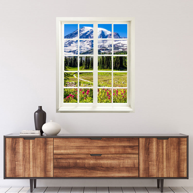 Hingucker für dunkle Räume oder ohne Fenster, selbstklebendes Wandtattoo als gedruckter Fensterrahmen mit tollem Ausblick "Berge und Wildblumen" über einer Holz-Kommode.