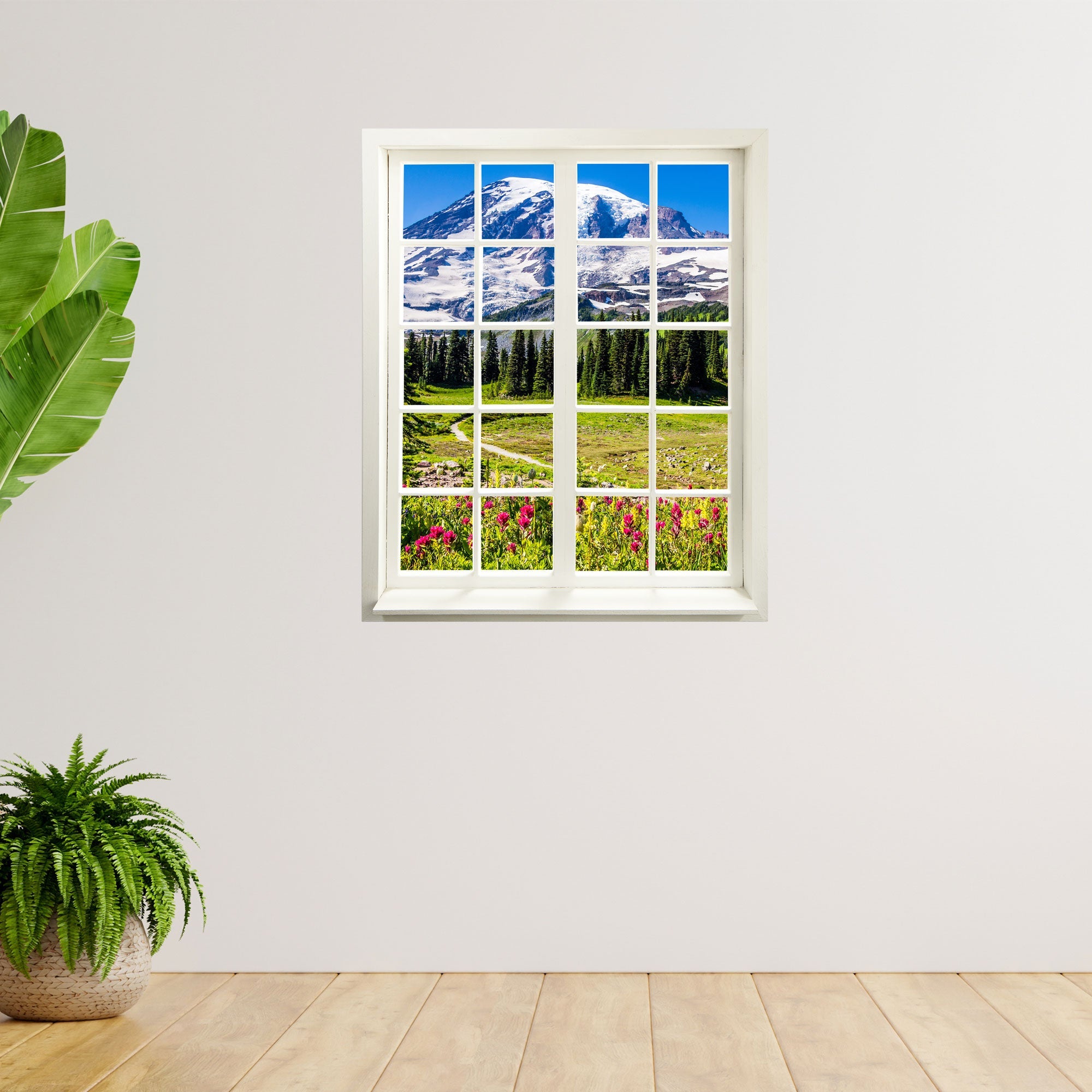 Wandaufkleber Sprossenfenster mit toller Aussicht, vergrößert Zimmer optisch. "Berge mit Wildblumen" Ausblick an einer freien Wand neben Zimmerpflanzen verklebt.