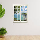 Wandtattoo Fensterblick "Meer und Bucht" neben Pflanzen auf weißer Wand.