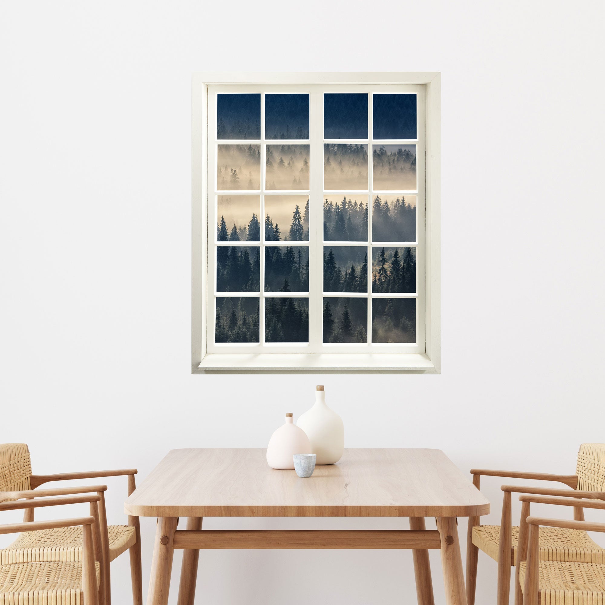 Wandtattoo Fensterblick "Nebelwald" an einer weissen Wand im Essbereich.