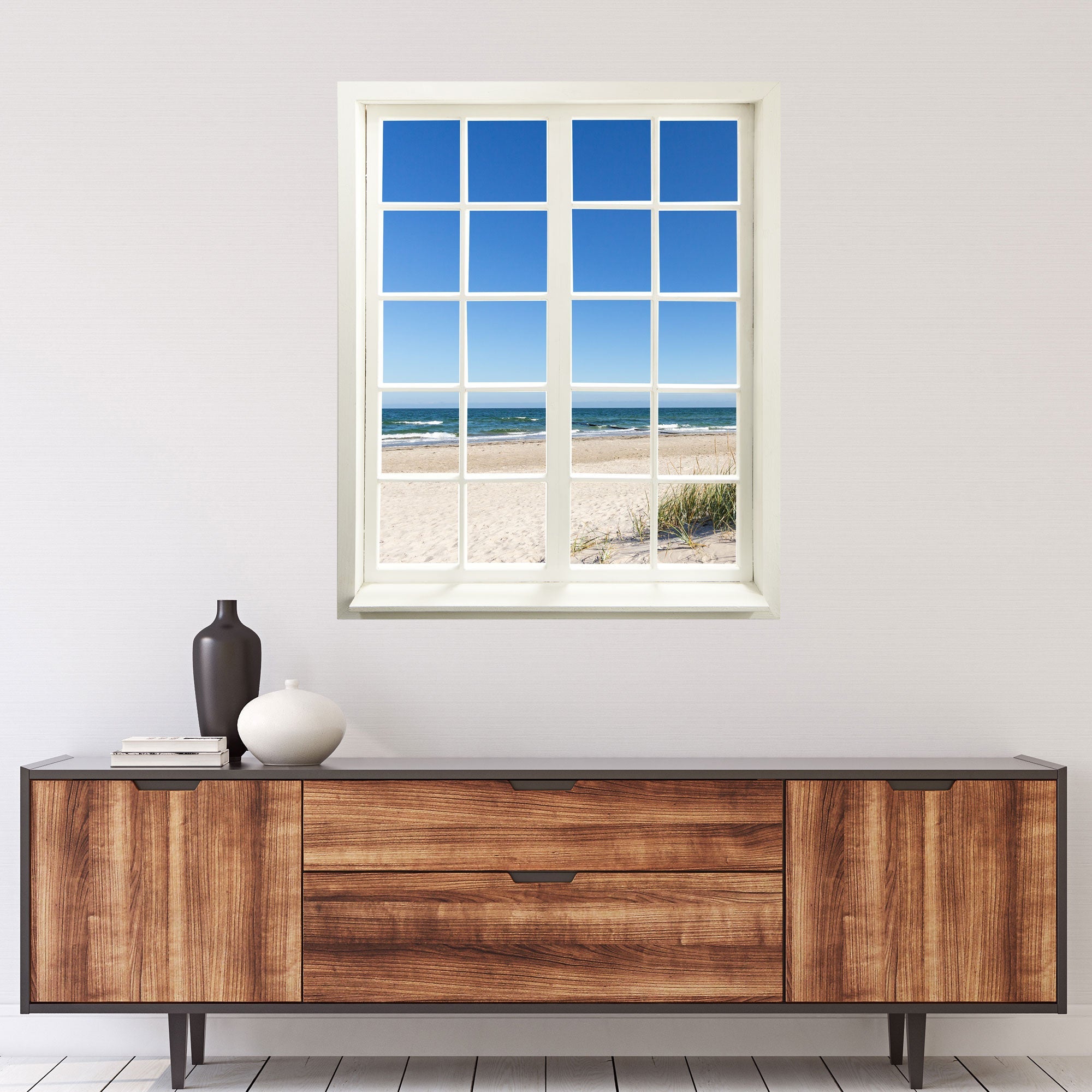 Selbstklebende Wandtapete in Form eines geschlossenen Fensters am Meer - Landschafts-Fotografie. Motiv: Ostsee Strand über einer Kommode an der Wand.