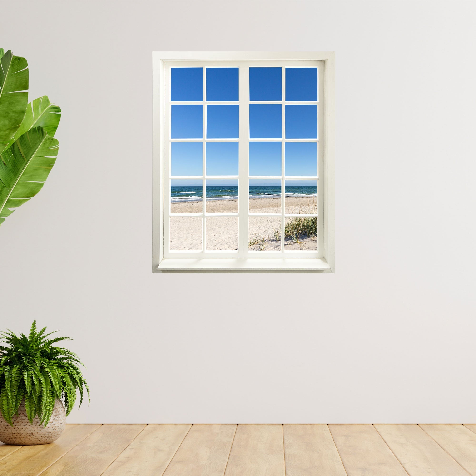 Innendekoration Wandaufkleber geschlossen, für jedes Zimmer mit Urlaubsmotiv Ostseestrand und Meer. An einer weissen Wand neben großen Zimmerpflanzen.