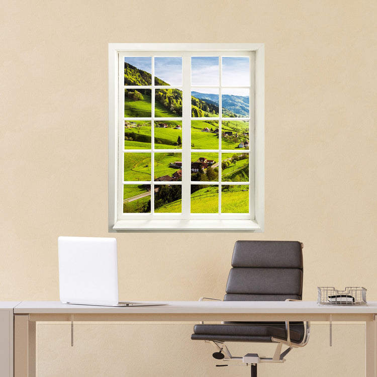 Wandtattoo Fensterblick "Schwarzwald" im Büro hinter dem Schreibtisch an einer gelben Wand verklebt.