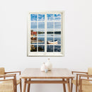 Selbstklebende Wandaufkleber- Fensterblick-Bild mit Blick auf ein Seeufer in Schweden für Flur, Bad oder Wohnzimmer. Hier für eine Raumvergrößerung über einem Esstisch aus Holz. 