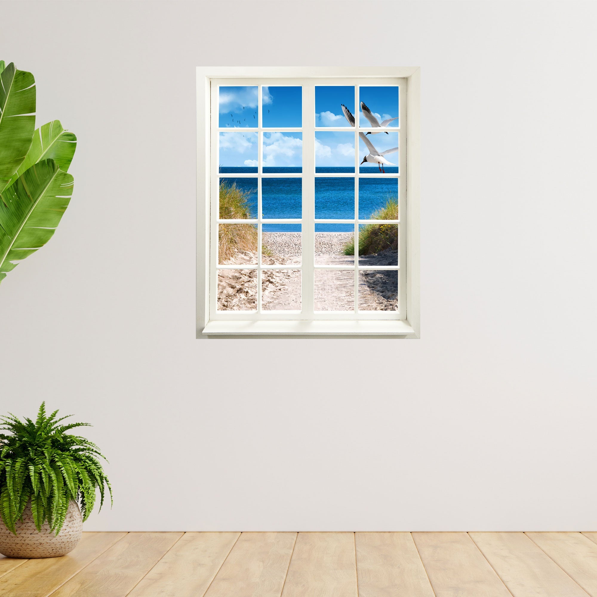 Wandtattoo Motiv Fensterblick "Strand mit Möwen" in hellem Zimmer mit Pflanzen.