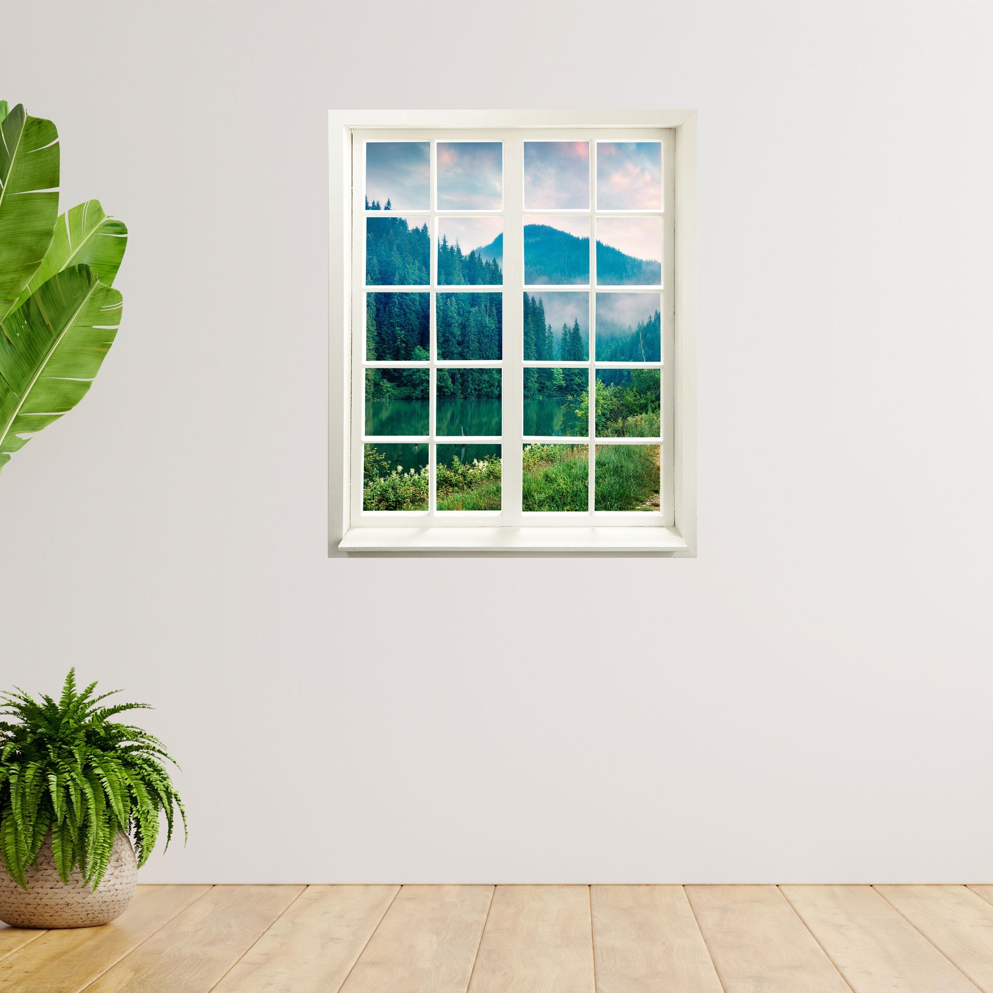 Wandaufkleber Sprossenfenster mit toller Aussicht vergrößert Zimmer optisch. Hier der "Tannenwald am See" an einer leeren Wand mit Zimmerpflanzen.