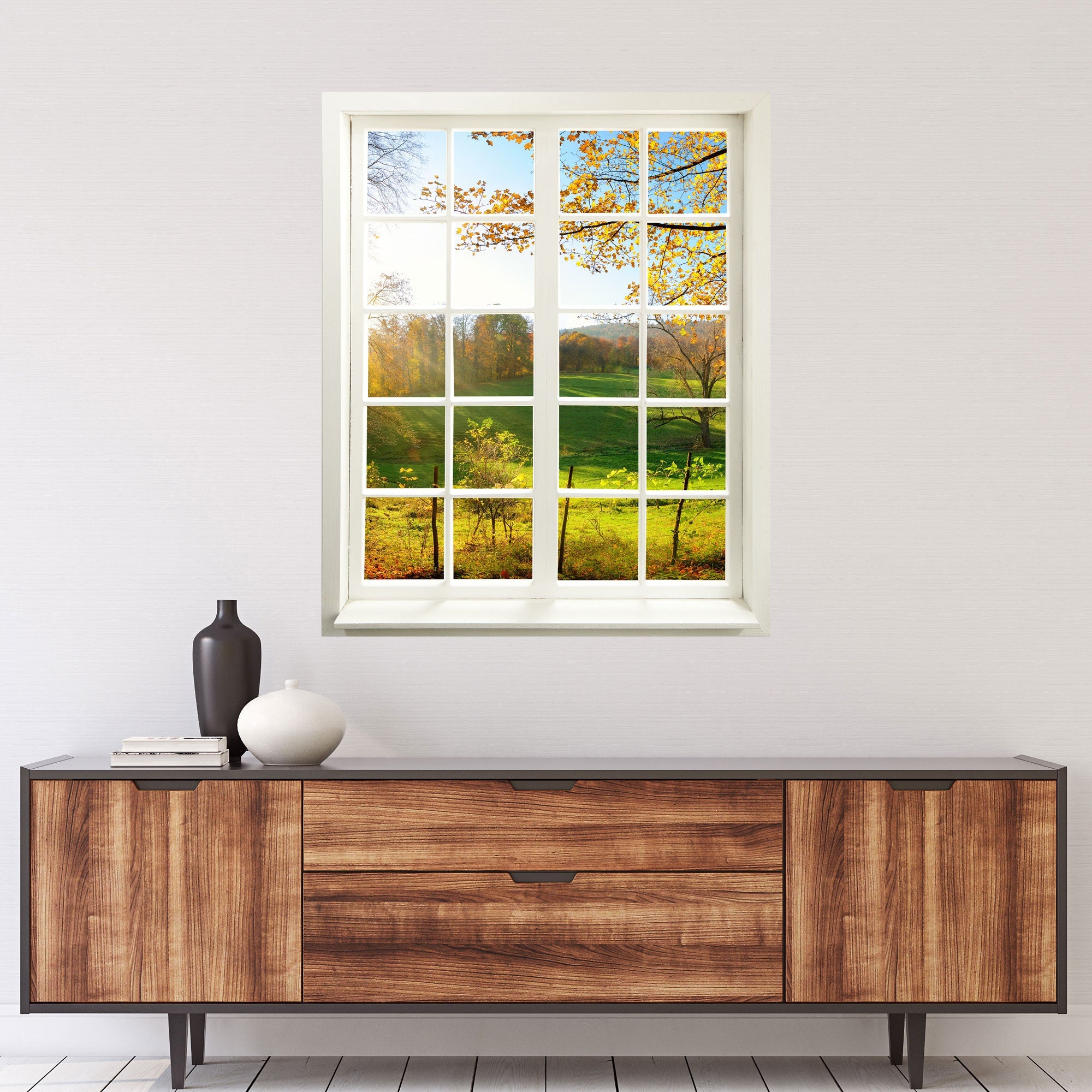 Fensterrahmen Wandaufkleber mit Sprossen und tollem Ausblick auf eine "Waldlichtung" für Flur und Wohnzimmer. Über einer Kommode.