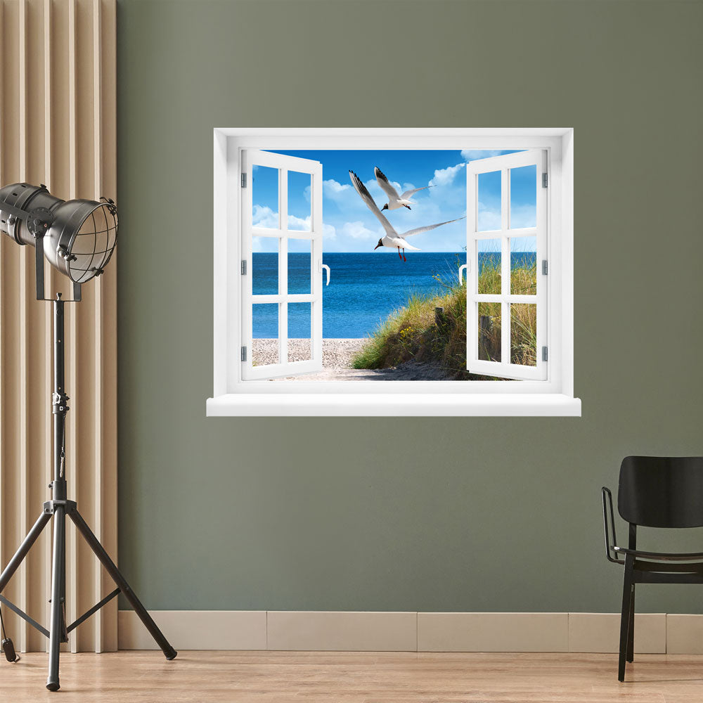 Selbstklebende Wandtapete in Form eines Fensters mit toller Landschafts-Fotografie "Strand mit Möwen" an einer grünen Wand in einem Studio.