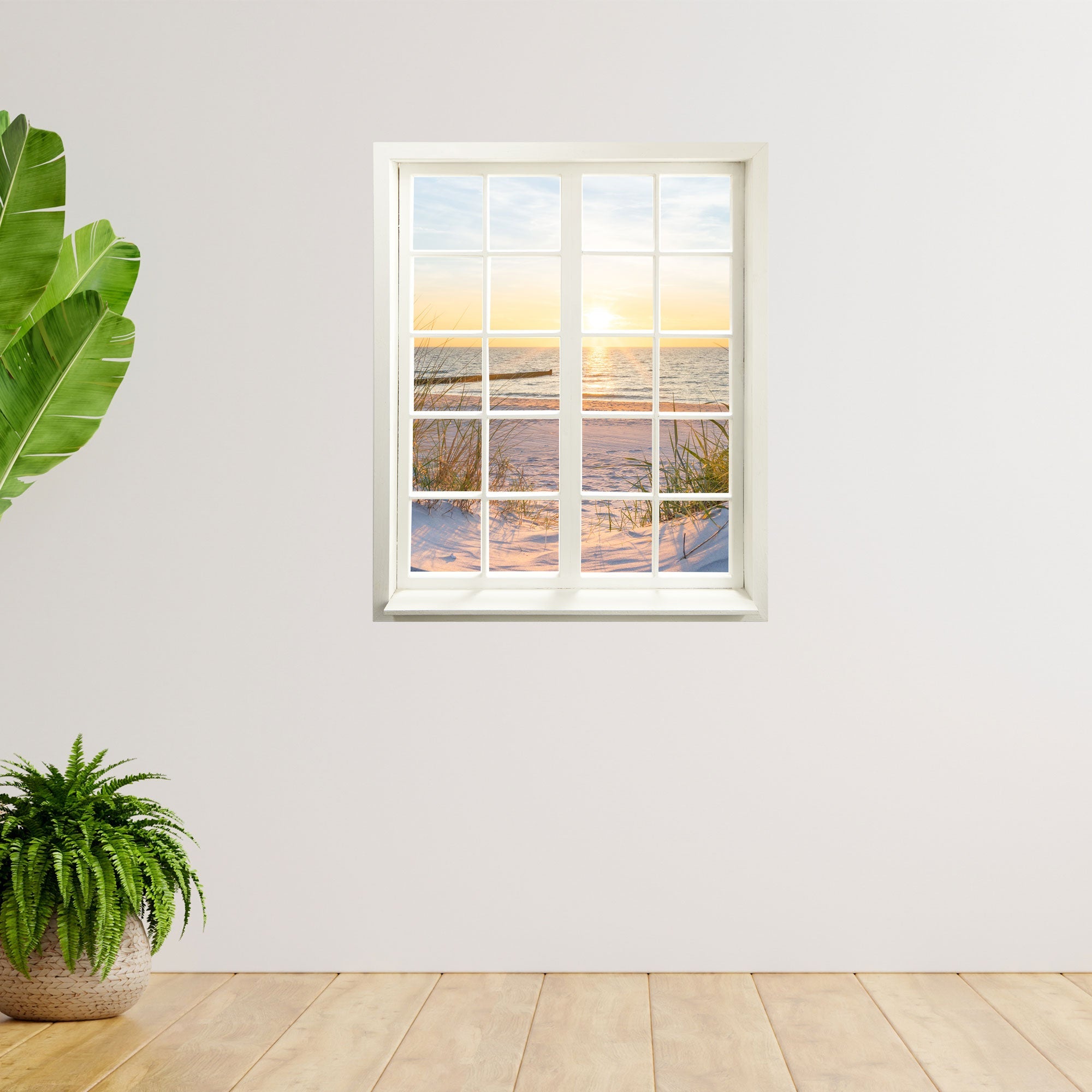 Romantische Urlaubs-Stimmung für ihr zu Hause, toller Ausblick inklusive gedrucktem Fensterrahmen. Motiv: Dünen und Meer, an der Wand neben Zimmerpflanzen.