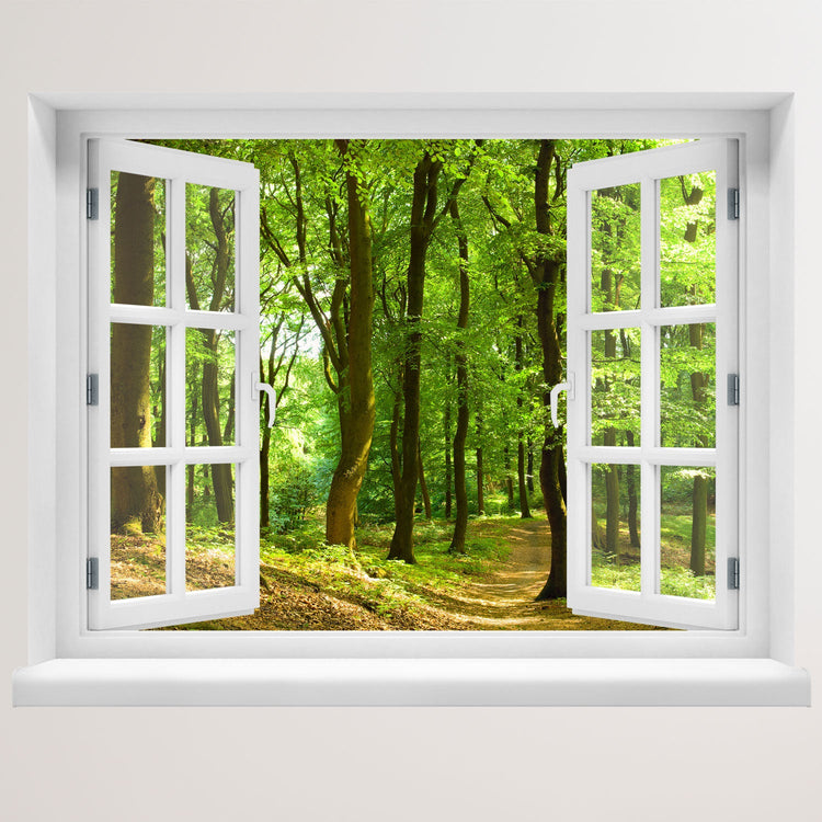 Wandaufkleber Ansicht eines offenes Fenster mit Blick in einen sonnendurchfluteten, grünen Laubwald mit einem schmalen Waldweg – entspannende Naturkulisse mit Frühlings- oder Sommerstimmung.