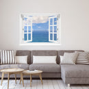 Wandaufkleber-Großansicht: offenes Fenster mit freiem Blick auf das weite, blaue Meer unter leicht bewölktem Himmel – beruhigende Meereskulisse mit Urlaubsfeeling. Als Dekoidee in einem Wohnzimmer, an einer weissen Wand über einer grauen Couch verklebt.