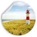 Großansicht eines runden Wandaufklebers mit dem Leuchtturm Motiv am Meer. Wobei eine Ecke abgezogen ist.