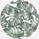 Schönes Wandbild im runden Format mit Monstera-Blättern in grünen Tönen. Perfekte Wanddekoration für jedes Zimmer.