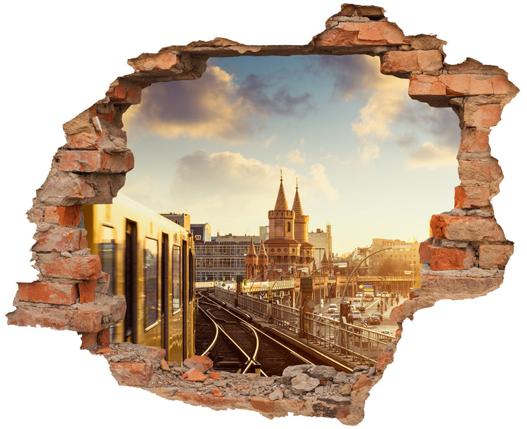 3D-Wandtattoo mit Backstein-Durchbruch, das eine Berliner U-Bahn zeigt, die auf Gleisen in Richtung der Oberbaumbrücke fährt – stilvolle urbane Wanddekoration.