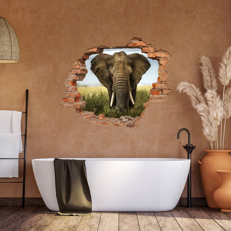 Wandtattoo Mauerdurchbruch "Elefant" an einer Steinwand in einem modernen Badezimmer über der Badewanne verklebt.