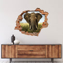 Wandtattoo Mauerdurchbruch "Elefant" über holz-farbigem Sideboard verklebt.