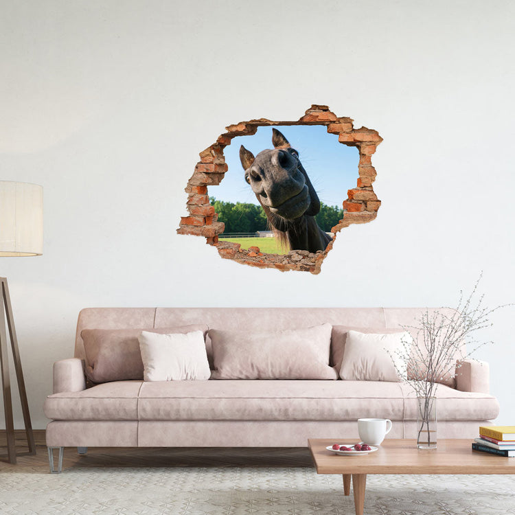 Wandtattoo Ziegelwand Durchbruch mit "Pferdekopf" in einem Wohnzimmer mit rosa Couch.