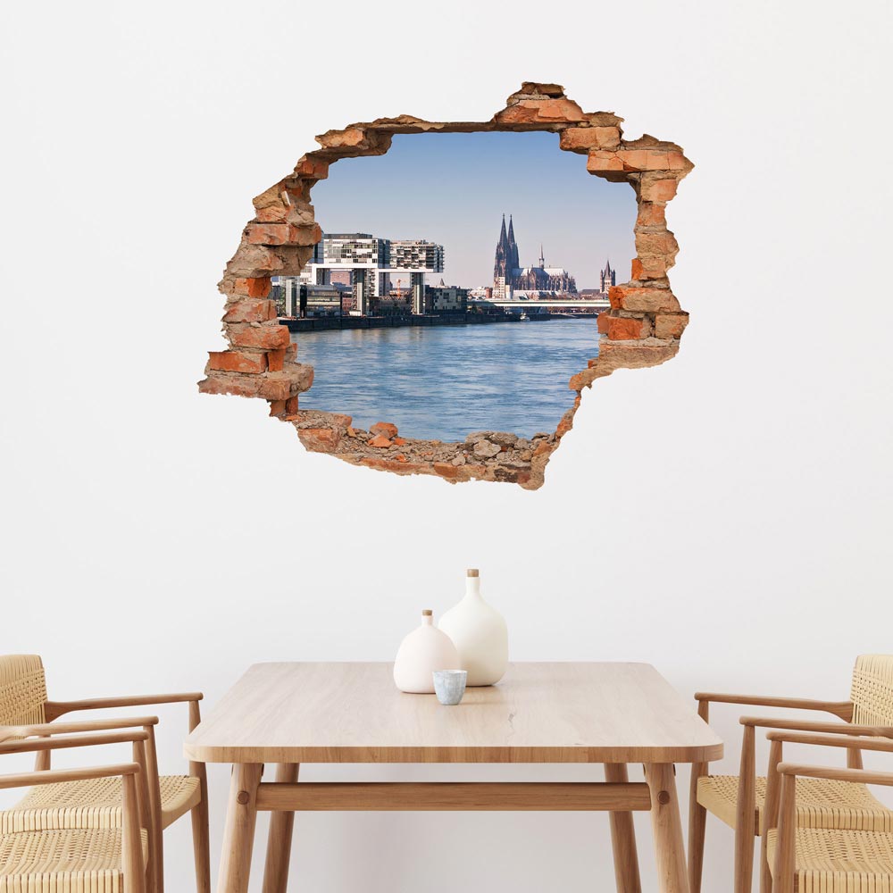 Modernes 3D-Wandtattoo mit Backstein-Optik im Esszimmer, das einen realistischen Blick auf den Kölner Dom und den Rhein bietet. Perfekte Wanddekoration für stilvolle Wohnräume.
