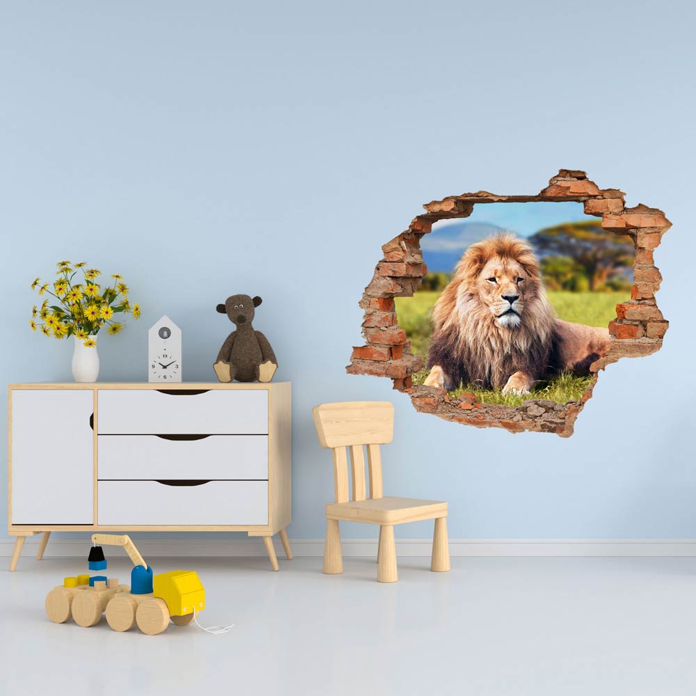 Wandtattoo Mauerdurchbruch Ziegel "Löwe" im Kinderzimmer an einer blauen Wand verklebt.