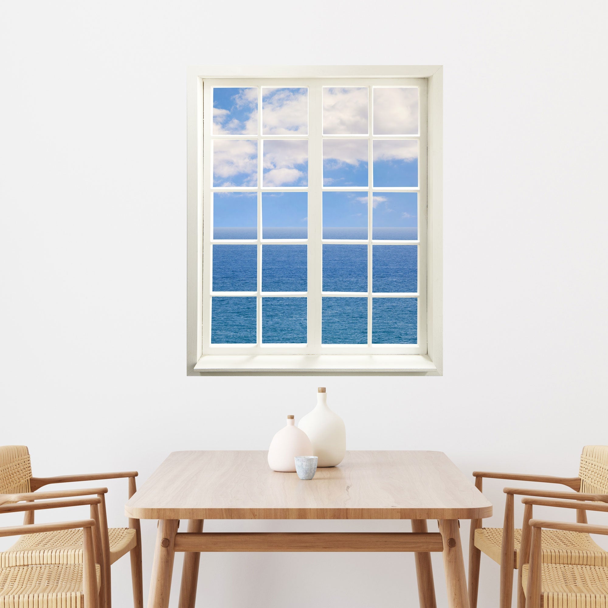 Wandaufkleber Sprossenfenster mit toller Aussicht "Meer und Wolken", hier über dem Essplatz, vergrößert Zimmer optisch.