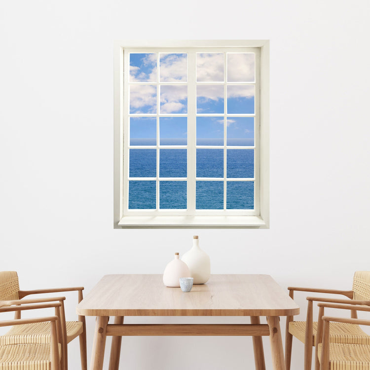 Wandaufkleber Sprossenfenster mit toller Aussicht "Meer und Wolken", hier über dem Essplatz, vergrößert Zimmer optisch.