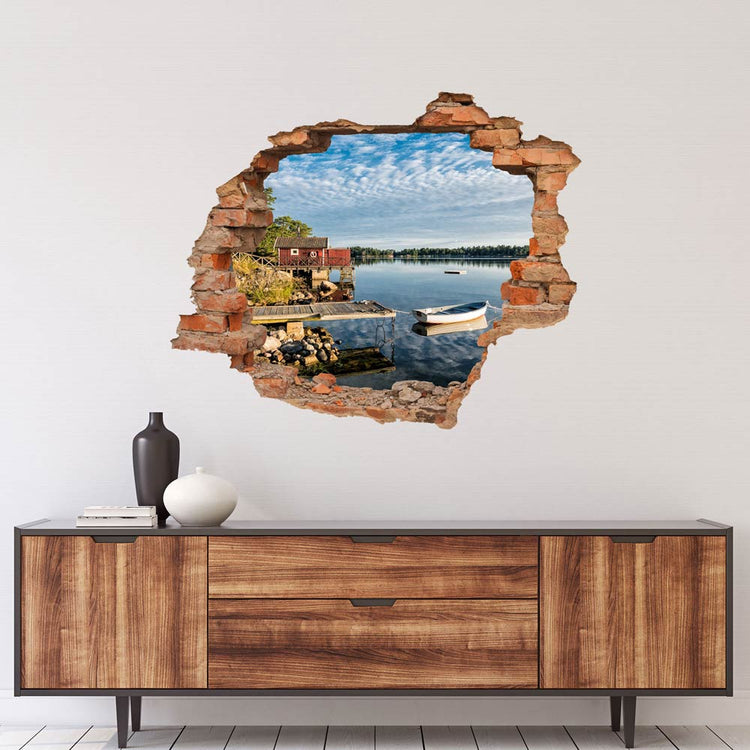 Wandaufkleber - Durchbruch "Seeufer" über braunem Sideboard.