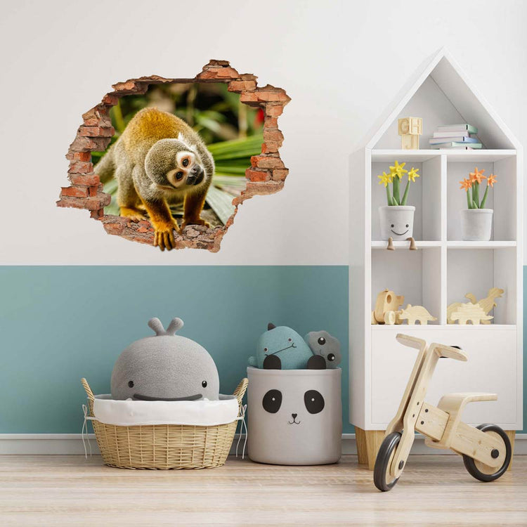 Wandtattoo - Wanddurchbruch "Affe" verklebt an einer Wand in einer Spielzeugecke mit einem Laufrad.