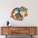 Wandtattoo - Wanddurchbruch "Zebra mit Fohlen" über braunem Sideboard an der Wand verklebt.